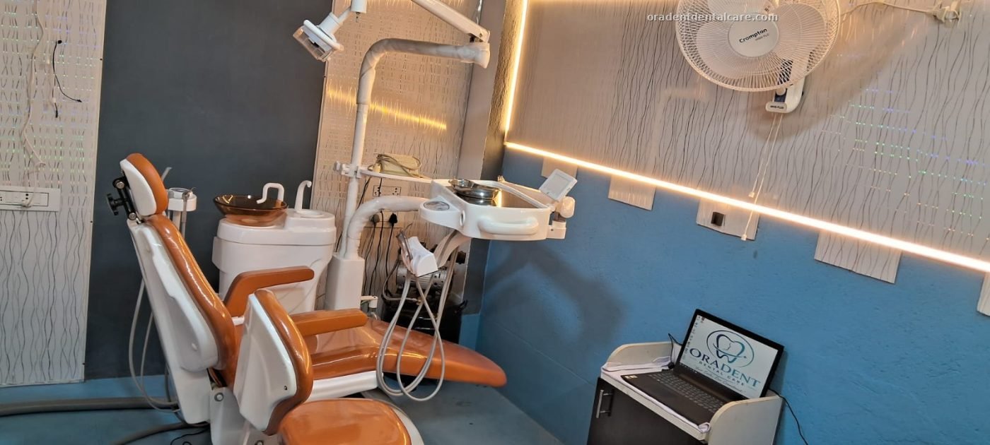 The treatment room at ORADENT Dental Care, with the dental chair, operating light and chairside unit
