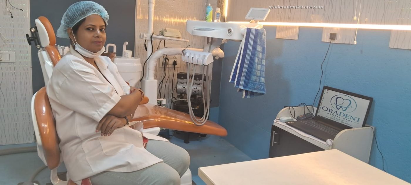 Dr. Nabanita Chaklader, BDS (WBUHS), seated in the treatment room at ORADENT Dental Care